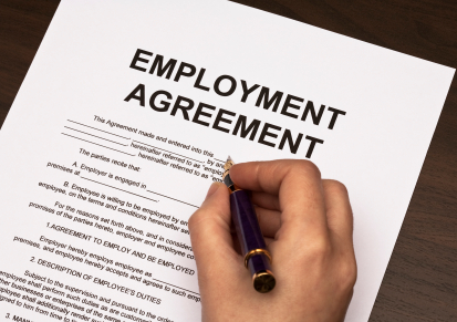 female hands filling out employment agreement contract